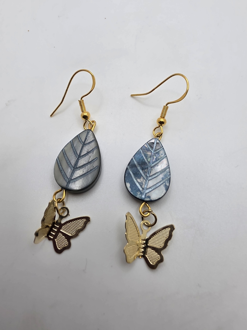 Gold Butterfly Drop Earrings with Blue Teardrop Leaf